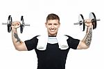 Young Bodybuilder Exercising, Toning His Biceps Stock Photo