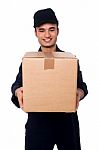 Young Boy Delivering Parcel Safely Stock Photo