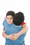 Young Boy Hugging His Father Stock Photo