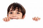 Young Boy Lifting His Head Out Of The Blank Board Stock Photo