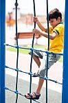 Young Boy On Playstructure Stock Photo