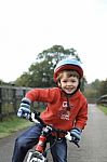 Young Boy Riding A Bike Stock Photo