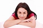 Young Brunette Lying On Bed Stock Photo