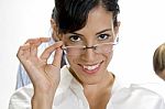 Young Brunette Woman Posing With Her Eyewear Stock Photo