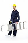 Young Builder Holding Stepladder Stock Photo