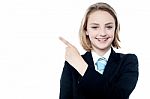Young Business Girl Pointing Away Stock Photo
