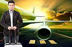 Young Business Man And Traveling Luggage Standing In Front Of Pa Stock Photo