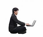 Young Business Man Working On Computer Laptop With Happy And Fun Stock Photo