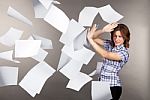 Young Business Woman With Flying Documents Stock Photo