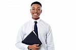 Young Businessman Holding Business File Stock Photo