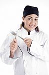 Young Chef Holding Cutlery Stock Photo