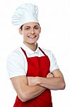 Young Chef With Crossed Arms Stock Photo