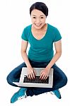 Young Chinese Woman Working On Laptop Stock Photo