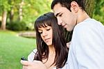Young Couple And Mobile Phone Stock Photo