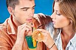 Young Couple Drinking Cocktail Stock Photo