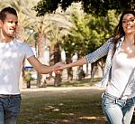 Young Couple Holding Hands Stock Photo