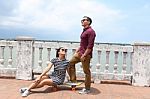 Young Couple In Love Outdoor With Skateboard Stock Photo