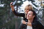 Young Couple In Park Stock Photo