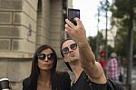 Young Couple Taking Selfies Stock Photo