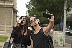 Young Couple Taking Selfies Stock Photo