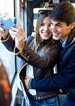 Young Couple Taking Selfies With Smartphone At Bus Stock Photo