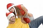 Young Couple Wearing Santa Hat Stock Photo