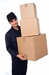 Young Courier Boy Moving Boxes Stock Photo