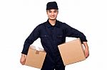 Young Courier Guy Holding Boxes Stock Photo