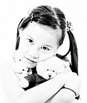 Young Cute Girl Hugging Her Teddy Bear Stock Photo