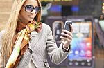 Young Fashionable Woman reading sms Stock Photo