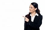 Young Female Executive Pointing At Something Stock Photo