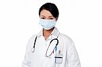 Young Female Surgeon Wearing Face Mask Stock Photo