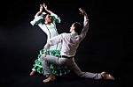 Young Flamenco Dancers In Beautiful Dress On Black Background Stock Photo