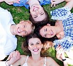 Young Friends Forming A Circle Stock Photo