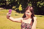 Young Girl Making Selfie In A Park Stock Photo