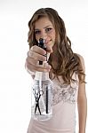 Young Girl Showing Spray Bottle Stock Photo