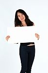 Young Girl Smiling Holding Blank Card Stock Photo