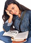 Young Girl Studying Text Books Stock Photo