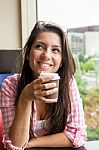 Young Girl With A Warm Drink Stock Photo