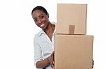 Young Girl With Cardboard Boxes In Hand Stock Photo
