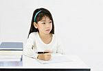 Young Girl Writing Homework Stock Photo