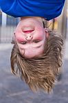 Young Girls Head Hanging Upside Down Stock Photo
