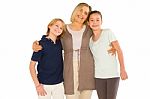 Young Grandmother With Nephew And Niece Standing On White Backgr Stock Photo