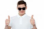 Young Guy Gesturing Thumbs Up Stock Photo