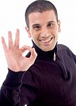 Young Guy With Okay Hand Gesture Stock Photo