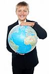 Young kid Holding Globe Stock Photo