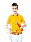 Young Kid Holding Two Big Colorful Pencils Stock Photo
