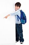 Young Kid Pointing To Empty Space Stock Photo
