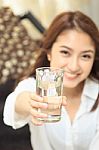 Young Lady Give A Glass Of Water Stock Photo