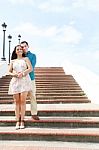 Young Lovers Hugging On Stairs Stock Photo